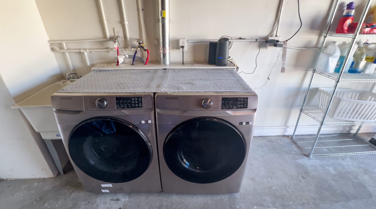 On-site laundry with two washers and two dryers for residents at Her Aria recovery residence, Montclair CA