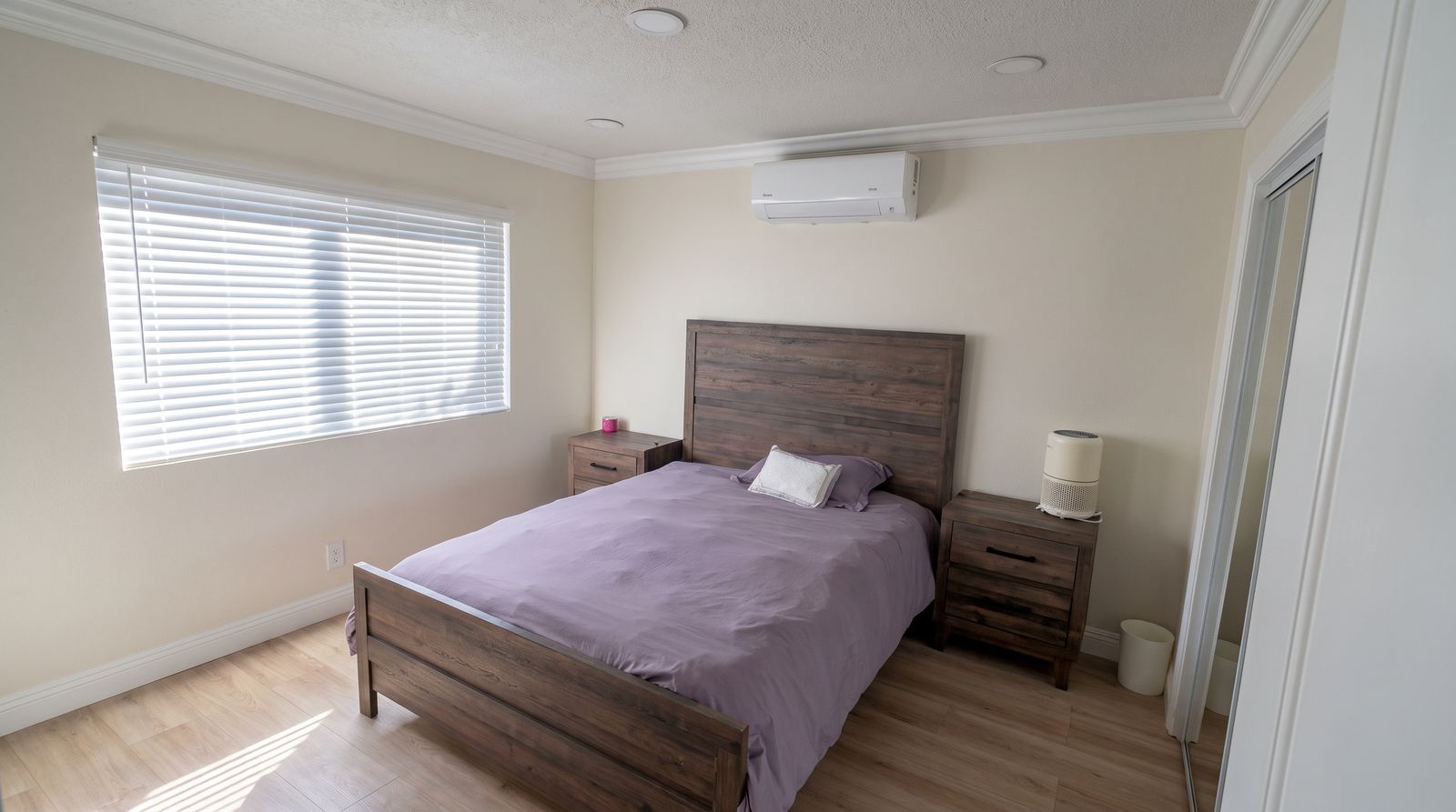 Second furnished bedroom with full bed, two nightstands and closet at Her Aria women's recovery residence in Los Angeles and San Bernardino Counties